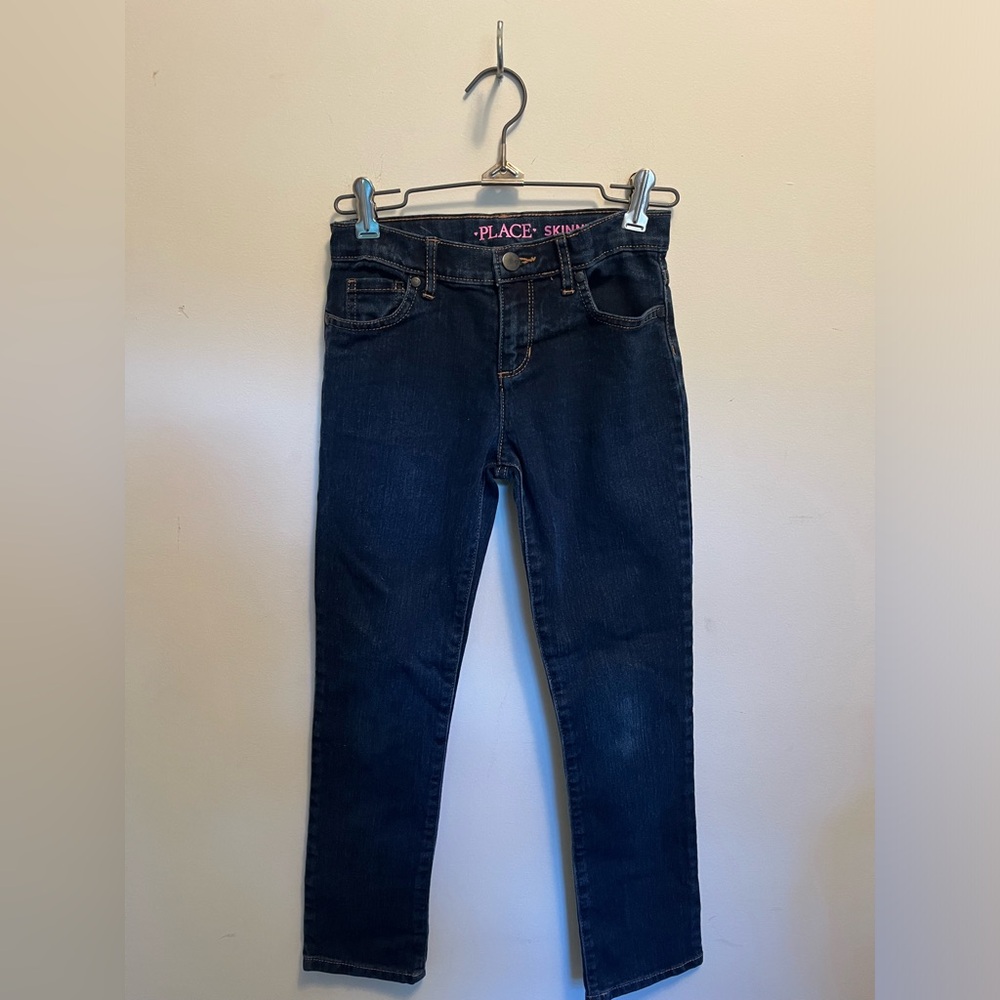 Place, girls youth dark blue skinny jeans with heart detailing on buttons.